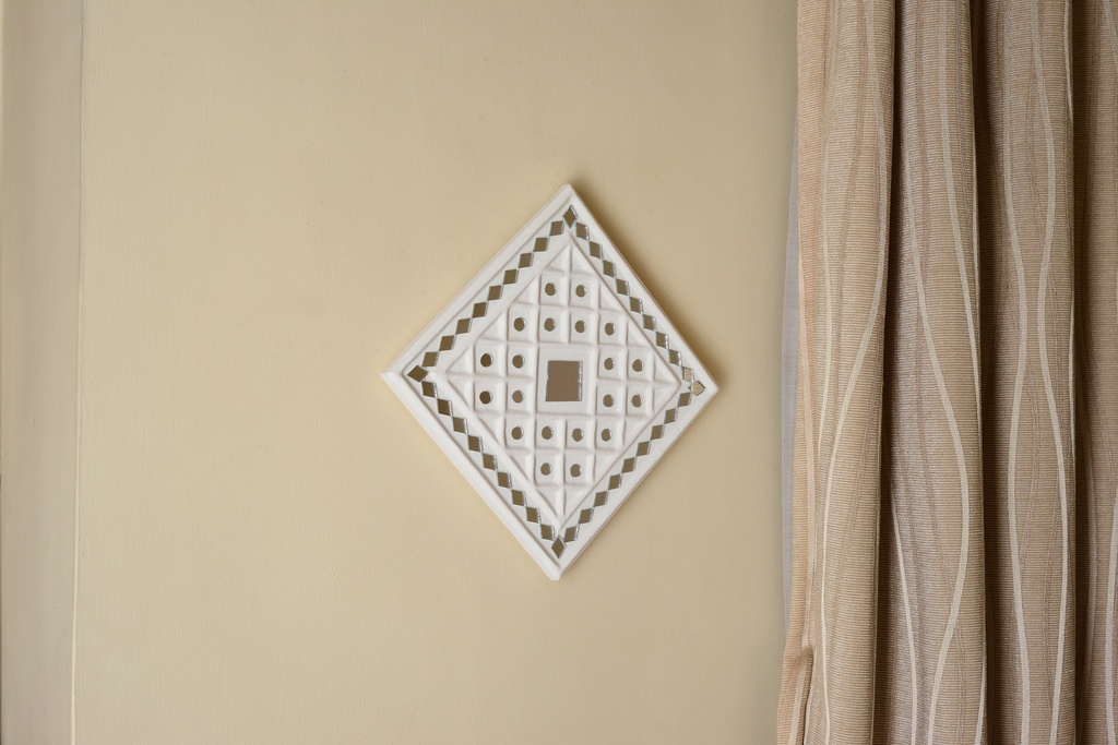 Handcrafted White Mud and Mirror Work Wall Hanging